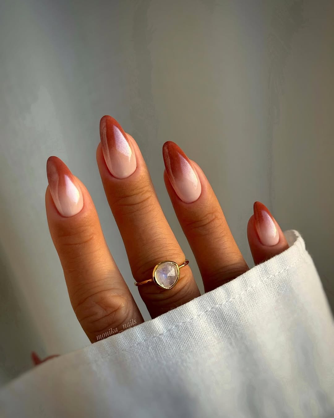 Almond-nails-with-a-nude-to-cocoa-gradient-and-shimmer-paired-with-a-ring-and-crisp-white-shirt-for-a-chic-look._.jpg