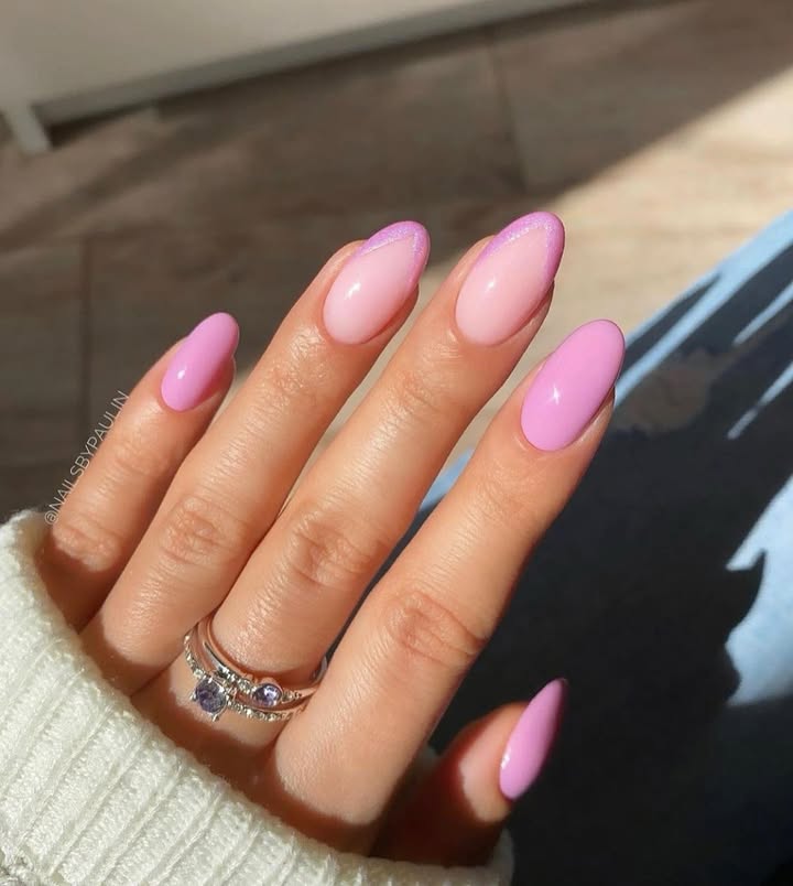 Close-up-of-hand-with-bubblegum-pink-glazed-almond-nails-with-lilac-sparkle-tips.jpg