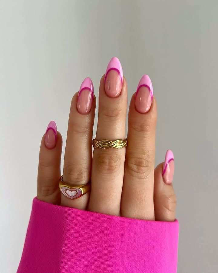 Close-up-of-hand-with-cherry-candy-pink-French-tips-inspired-by-Barbiecore-and-Y2K-nostalgia.jpg