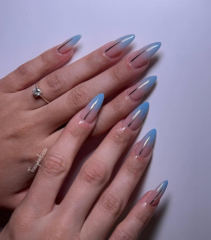 Cloud-kiss-nails-with-a-nude-to-blue-ombre-base-finished-with-sleek-metallic-accents-for-a-dreamy-and-modern-chic-look.jpg