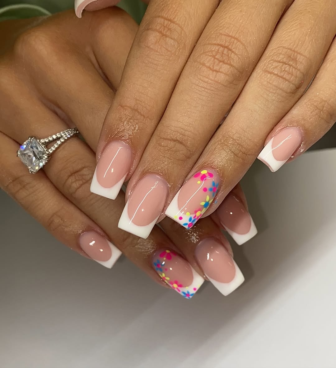 White-french-tip-nail-with-colorful-confetti-accents.