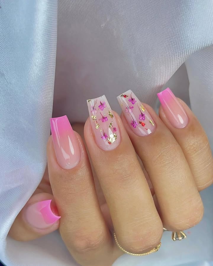Hand-with-blush-pink-ombre-nails-featuring-floral-details-and-gold-foil-accents.jpg