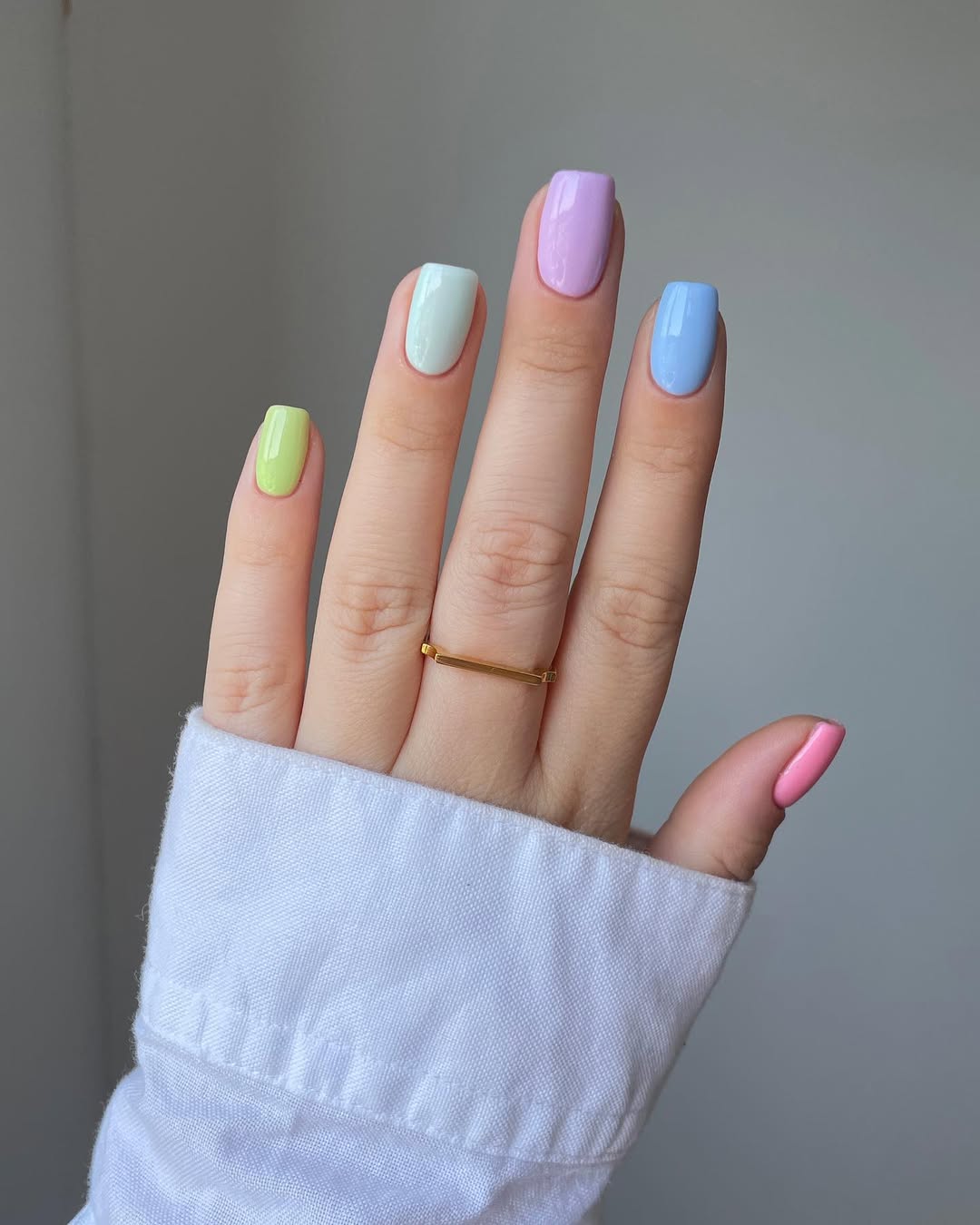 Hand-with-glossy-pastel-rainbow-nails-desings-2025