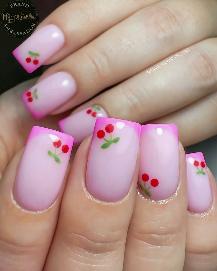 Hands- pink-French- tip-nails-painted-cherries-on-a-soft-pink-base.jpg