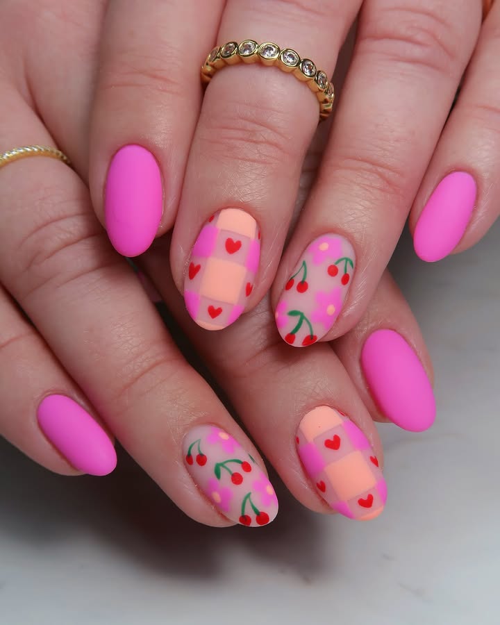 Hands-with-cotton-candy-pink-nails-decorated-with-cherries-and-heart-accents.jpg