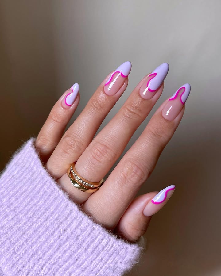 Hands-with-pink-mirage-nails-featuring-a-glossy-nude-to-lavender-gradient-and-playful-neon-pink-waves.jpg