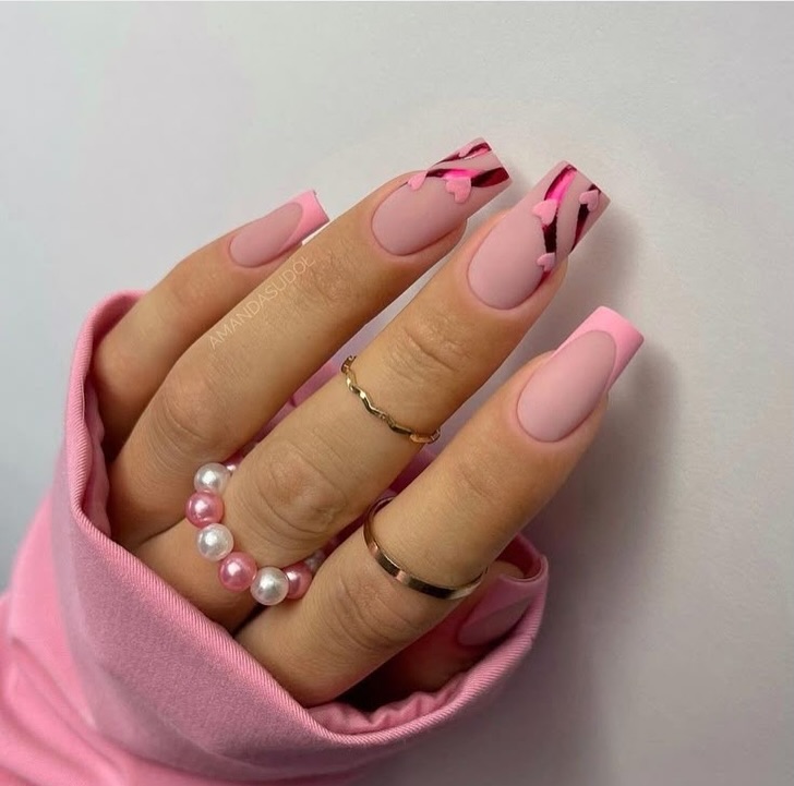 Hands-with-pink-velvet-heart-nails-soft-pink-French-tips-and-bold-heart-motifs.jpg