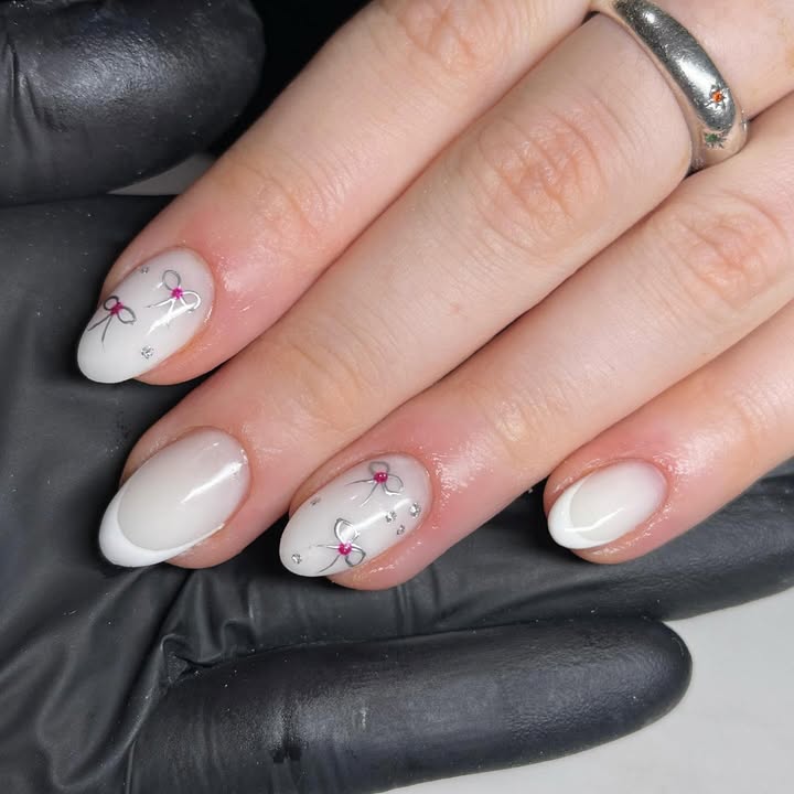 Moonlit-lace-white-french-tip-nail-design-with-creamy-tones-and-crystal-blossoms.