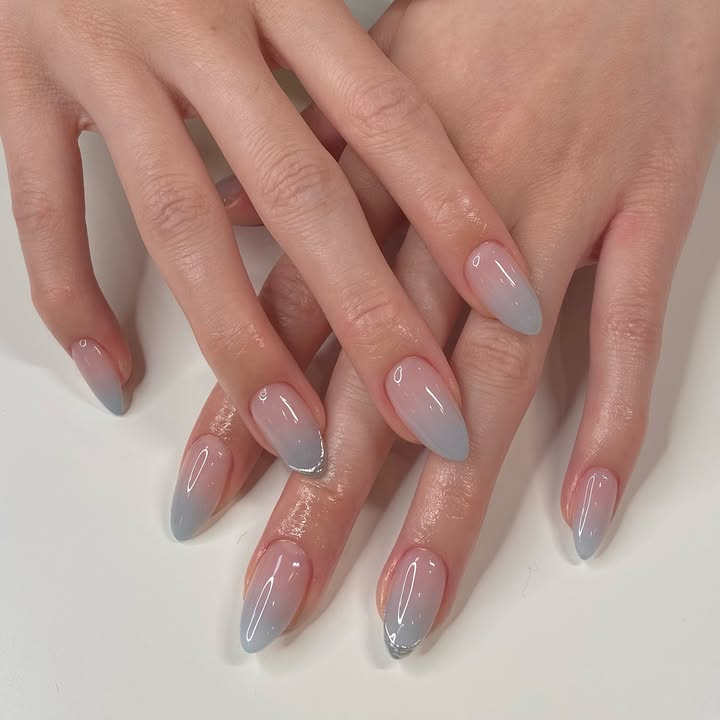 Smoky-sky-ombre-nails-with-a-gray-blue-gradient-creating-a-minimalist-luxe-take-on-French-tips._.jpg