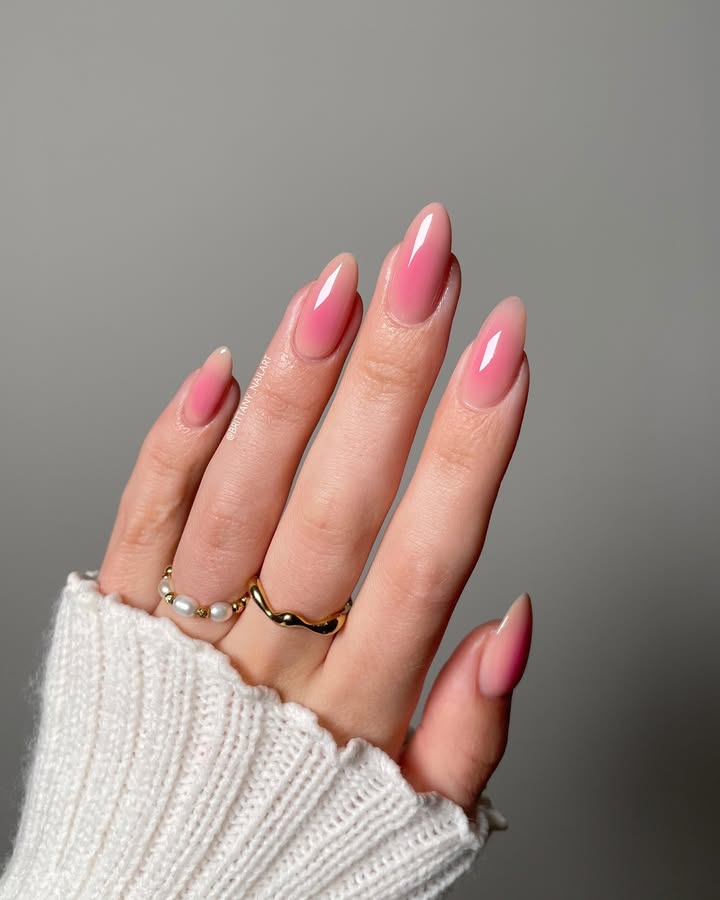 Soft-petal-ombre-nails-in-natural-pink-tones-paired-with-rings-and-a-cozy-white-sweater-for-a-minimal-elegant-look.jpg