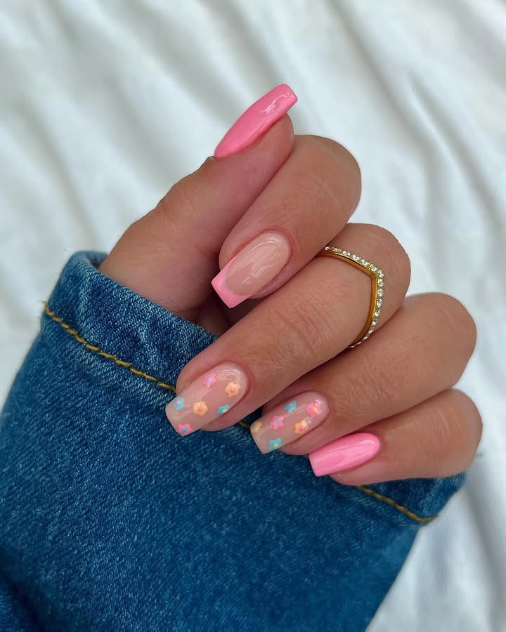 Soft-pink-nails-with-delicate-floral-designs-and-a-glossy-dewy-finish-paired-with-blue-jacket.jpg