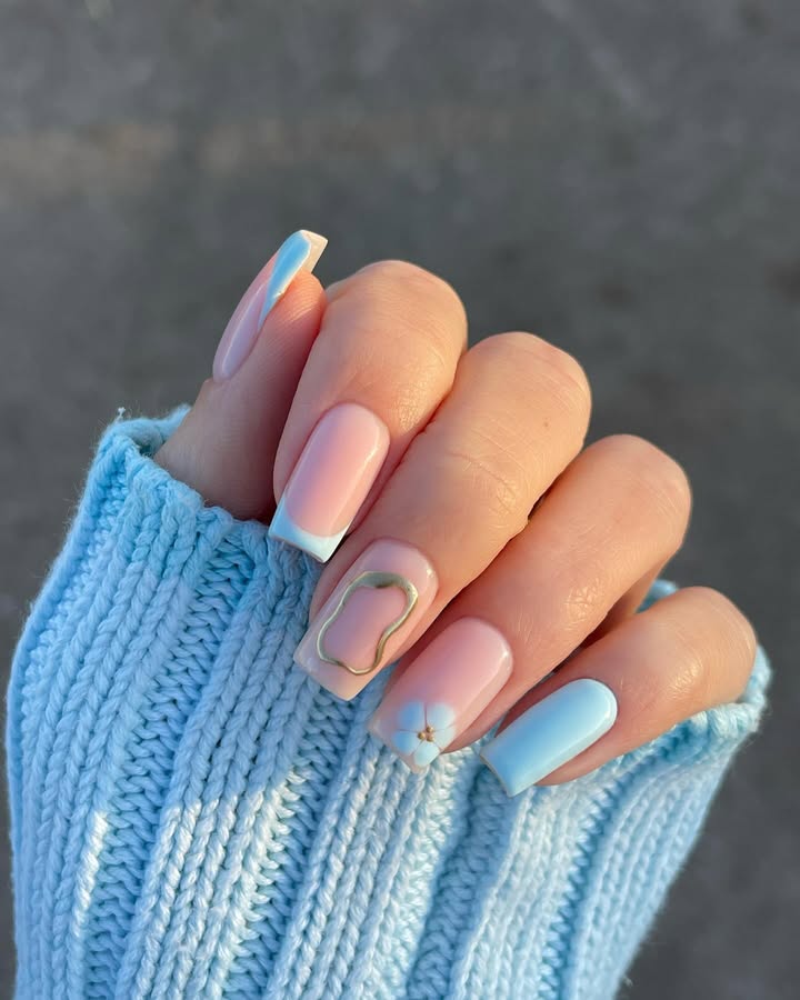 Airy-blue-nails-with-gold-squiggle-accents-and-subtle-florals-1.jpg