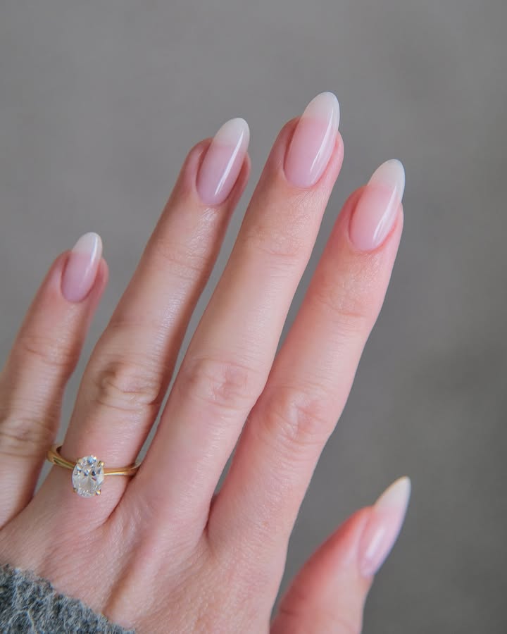 Almond-shaped-nails-with-a-soft-milky-white-glaze.jpg