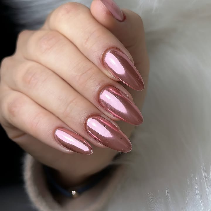Close-up-of-almond-shaped-nails-with-a-soft-pink-chrome-finish.jpg