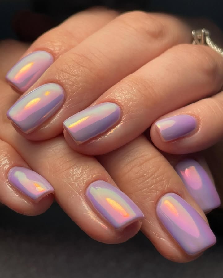Close-up-of-lavender-nails-with-a-bold-mix-of-molten-chrome-and-dreamy-pastel-swirls.jpg