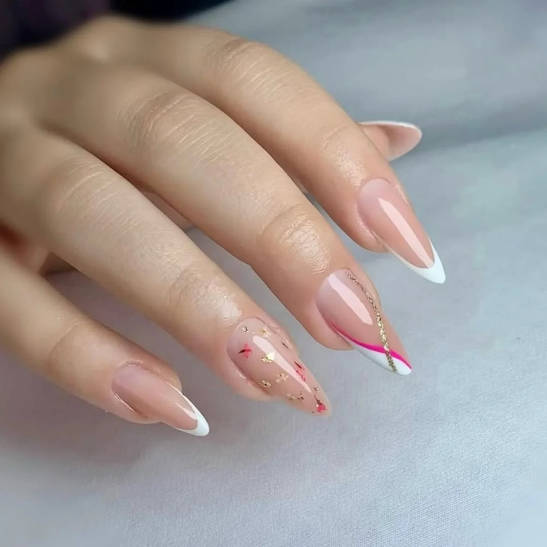 Flirty-May-nails-with-hot-pink-gold-foil-floral-flakes-and-stiletto-French-tips.jpg