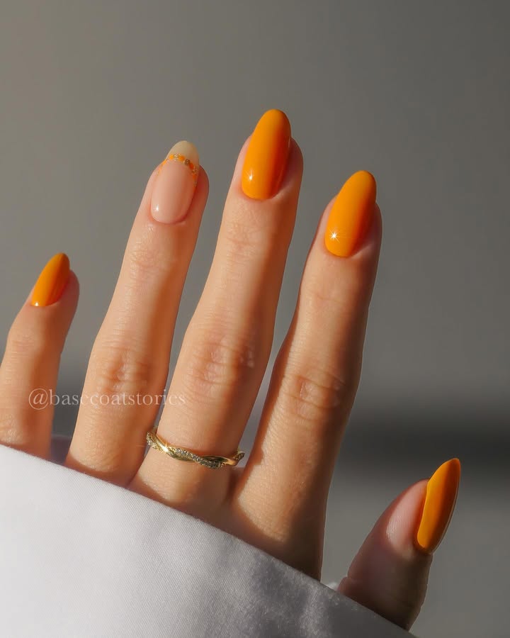 Fresh-spring-ready-juicy-orange-nails-with-a-golden-swoop.jpg