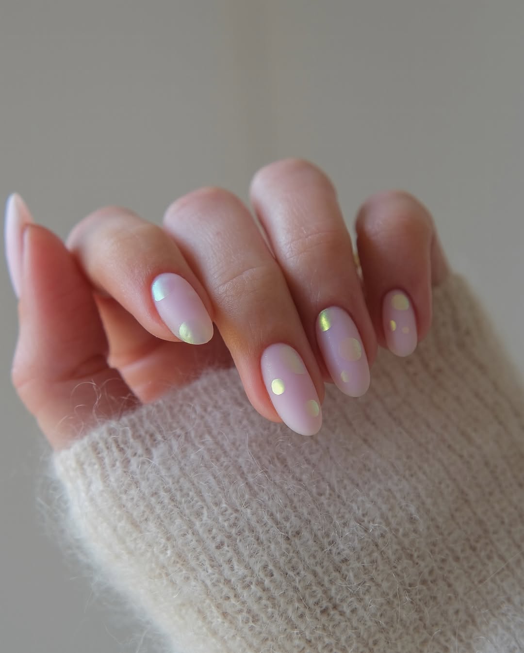 Glazed-Confetti-May-nails-with-sheer-pink-base-and-glowing-shimmer-dots.jpg