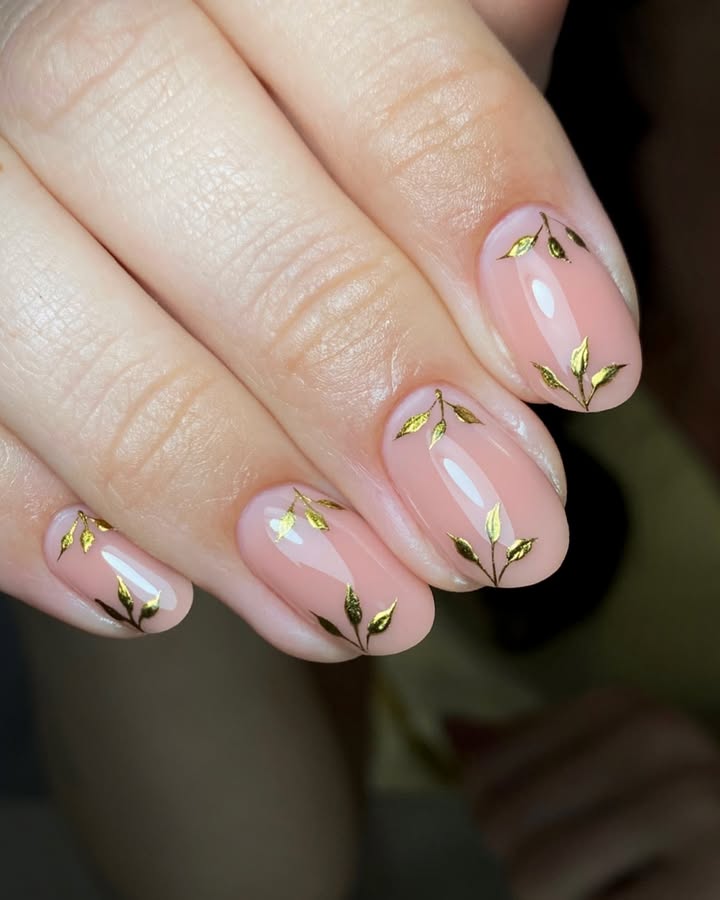 May-nails-with-soft-milky-base-gold-veins-and-optional-crystals.jpg
