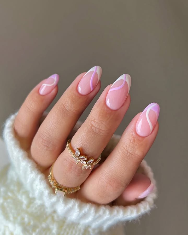 Soft-pink-nails-with-white-and-lavender-swirls-perfect-for-May-nails._.jpg