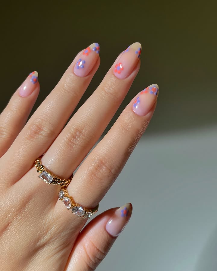 Sweet-Bloomis-May-nails-with-coral-lilac-and-playful-floral-accents.jpg
