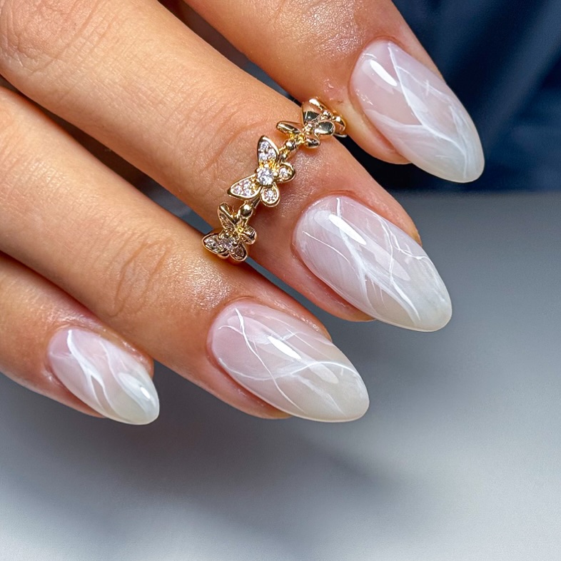 Velvety-milky-white-swirl-nails-with-a-soft-serene.jpg