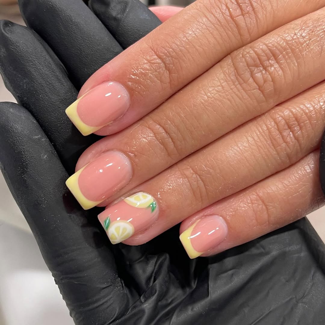 Buttery-yellow-French-tip-nails-with-lemon-slice-accents.__.jpg