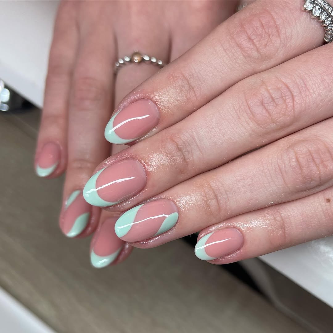 Glossy-nude-French-tips-with-flowing-mint-green-strokes.__.jpg