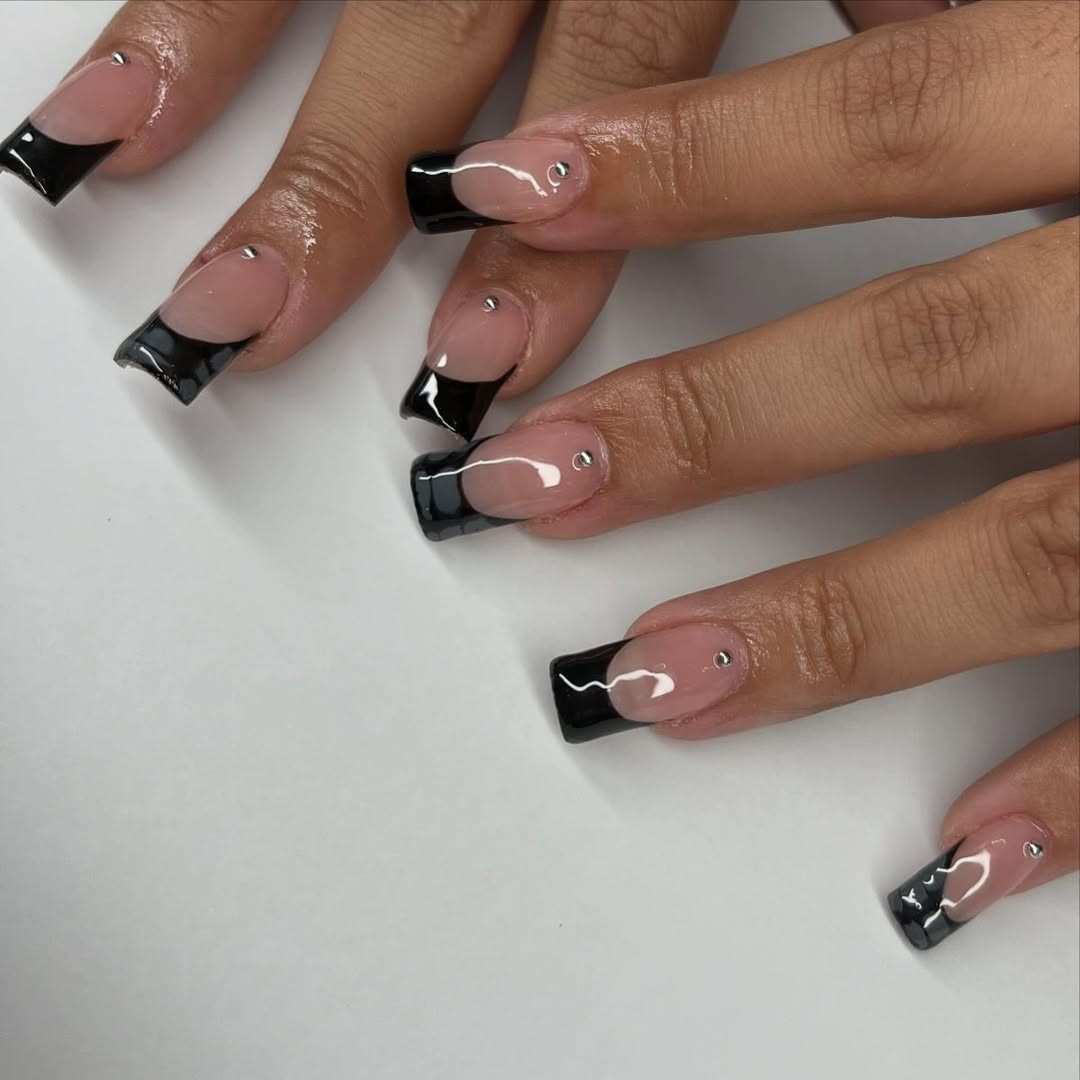Dark halo black French tip nails.jpeg