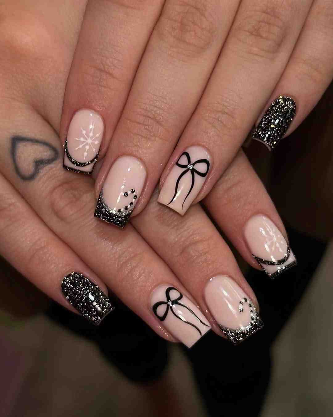 Snowflake design black French nails.jpeg